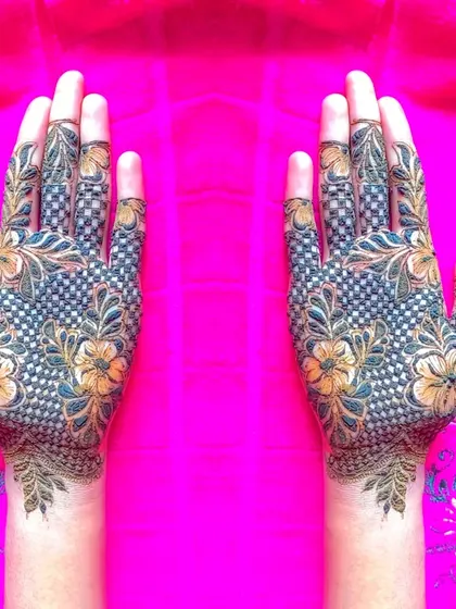 A full-hand net design, where the 'jaal' is filled with tiny flowers. A very detailed and beautiful style.