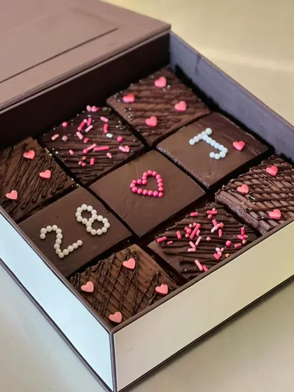 Another example of our custom chocolate bars, decorated with numbers and sprinkles for a client's special occasion. We can tailor the decorations to match your event theme or message.