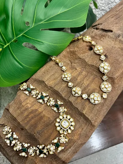 A wider view of the two kundan necklaces, showcasing their intricate craftsmanship and timeless appeal.