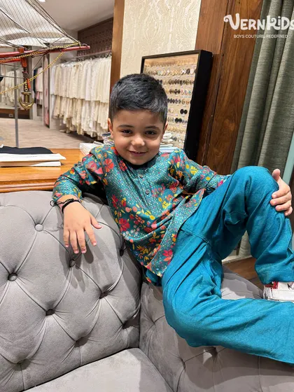 Our client looking cool and relaxed in a vibrant printed kurta set, proving that ethnic wear can be both stylish and easy to wear.