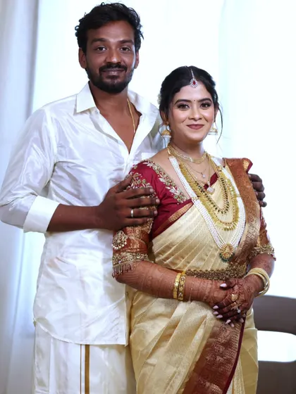 A lovely portrait of the bride and groom. Her traditional attire is perfectly complemented by a makeup look that is both elegant and timeless.