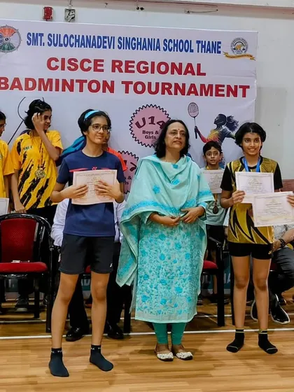 Our champions on the podium. Khanak Jhalani and other winners at the CISCE regional badminton tournament, proudly holding their certificates of achievement.