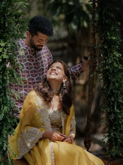 A candid moment of love and laughter on the swing.