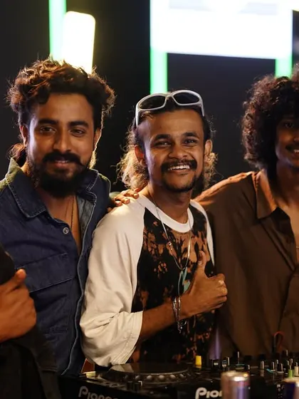 Posing with my DJ Fam behind the decks. This is the team that makes the magic happen.
