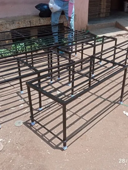 A set of newly fabricated two-tier stands, showing the strong welded joints and the floor-safe bushes on each leg. These are built to handle significant weight.