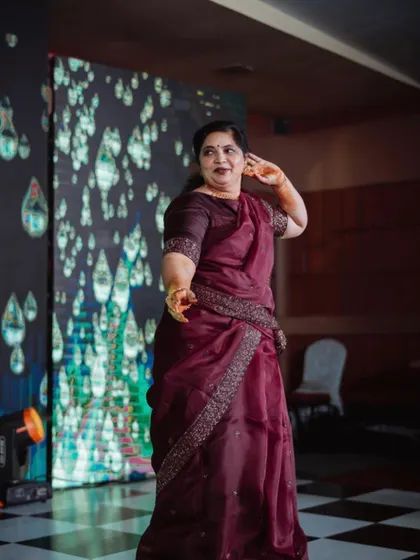 The joy of dance is for everyone. Here, a guest takes the stage to perform at a Sangeeth, with our dynamic LED screen providing a beautiful, moving background.
