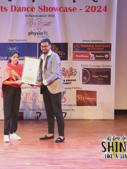 A student receiving her award at the "It's Time to Shine" showcase.