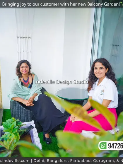 A candid moment with a happy client in her new balcony garden. My design consultant is seen here discussing the project, reflecting my commitment to ensuring client satisfaction from start to finish.