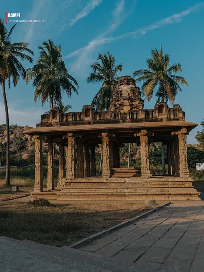 A series of images presented as pages from a travel magazine, each with a text overlay explaining Hampi's history. These photos capture various ruins, including temple tanks, stone pillars, and mandapas, telling the story of the lost empire.