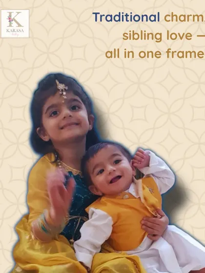 Traditional charm and sibling love, all in one frame. This adorable duo is wearing a custom-designed yellow and teal set for a family function.