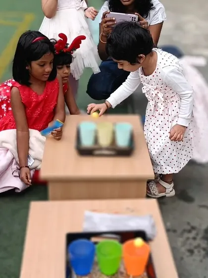 A color sorting game at the Christmas party. Even our carnival games are designed with a learning objective in mind, making them both fun and educational.
