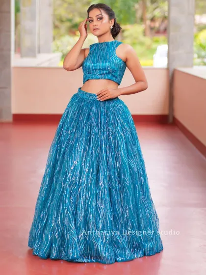A full-length shot of the teal sequin lehenga, a perfect choice for a cocktail party or sangeet.