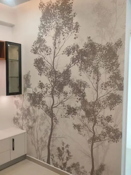 A delicate tree silhouette wallpaper that adds a touch of nature and artistry to this room corner.
