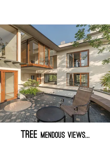 The home's design offers "TREE-mendous views," with large, strategically placed windows and a terrace that overlooks the surrounding canopy.
