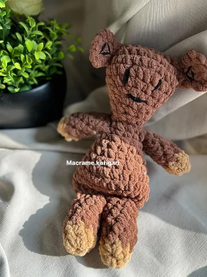 A tribute to a classic character, our handmade version of Mr. Bean's Teddy is crafted from soft, brown chunky yarn. We focused on getting his signature stitched eyes and limbs just right, creating a nostalgic and comforting companion for any fan of the show.