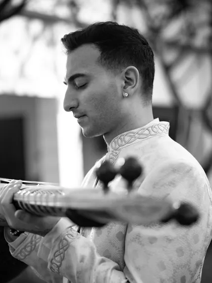 A black and white profile shot, capturing a moment of calm focus.