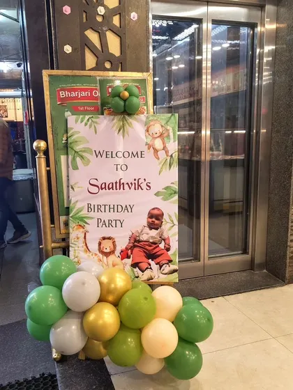 A personalized welcome sign with a jungle theme greets guests at the entrance of Saathvik's birthday party.