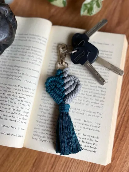 This two-toned heart keychain in teal and grey is a more subtle and modern take on the classic heart design.