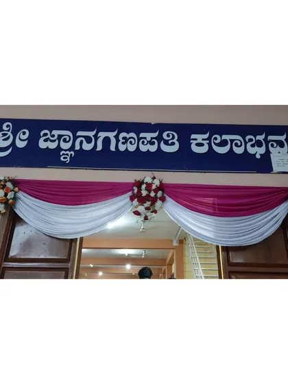 A simple yet elegant doorway decoration. We used draped fabric in white and magenta with small floral bouquets to beautifully frame the entrance to the main event hall.