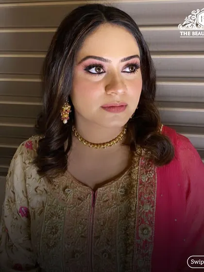 A side profile showing the soft contouring and the beautiful shimmer on her eyelids.