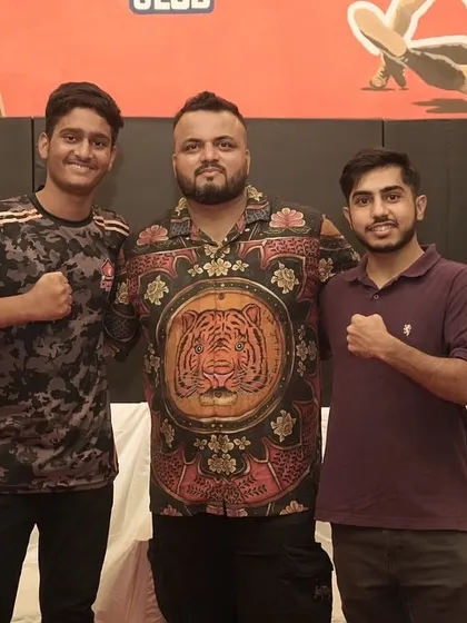 Me with two of our dedicated fighters during a team celebration. It's important to recognize the hard work they put in day in and day out.