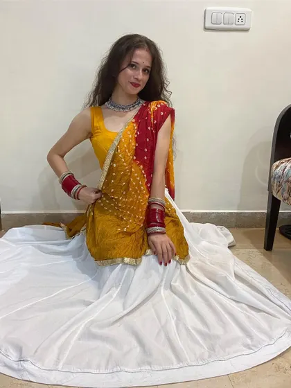 A seated pose in my Garba outfit. Even simple poses can be beautiful, and I focus on the details to make sure you look great from every angle during your performance.