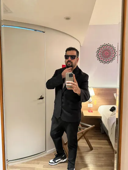 A mirror selfie showing off my look for a private event. I dress the part, whether it's a casual club night or a formal wedding gig.