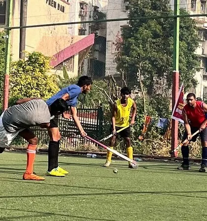 A tense moment as four players vie for the ball. This image captures the high level of engagement and competition that defines our practice sessions.