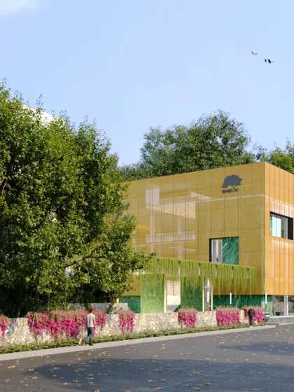 This clubhouse for an ultra-luxury villa project is conceived as a minimalist cube wrapped in a bronze metal mesh. The semi-transparent facade blurs the line between inside and out, and the building acts as a sophisticated gateway to the villa community.