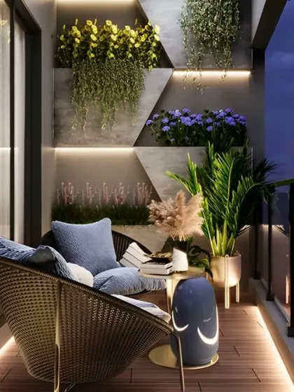 This balcony at dusk shows how lighting can create a magical atmosphere. The geometric wall feature with integrated planters is beautifully illuminated, making the space cozy and inviting even after the sun goes down.