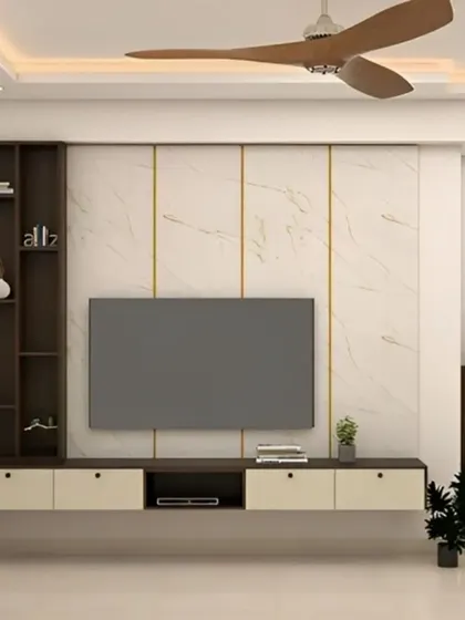 This entertainment unit features a light marble-effect wall with gold-toned vertical accents. The floating console in cream and dark wood is paired with a matching vertical shelf, creating a cohesive and elegant look.
