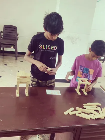 The focus in the room is always so real and inspiring. Each child gets their own set of planks and a space to bring their ideas to life, learning about balance and dedication through hands-on building.