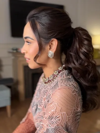 A side profile of the high ponytail, showing the height and volume I create for a dramatic and long lasting style.