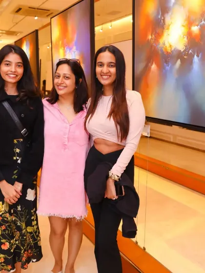 Guests posing for a photo at the opening night of 'Mystic Mirage', capturing the excitement of the event.