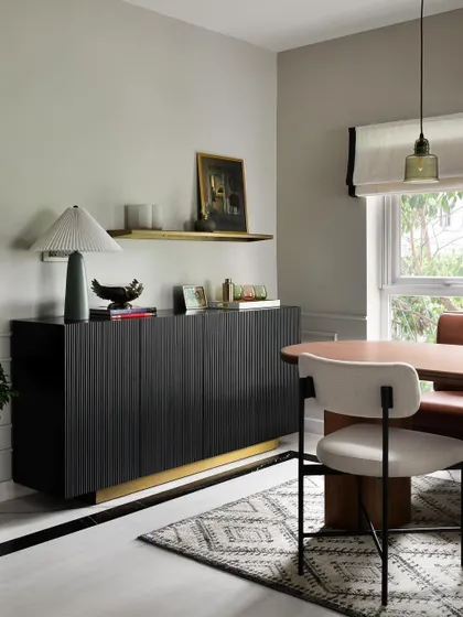 The same space, transformed into a bright and airy dining room. We relocated the kitchen and installed large windows, creating a beautiful area for the family to gather.