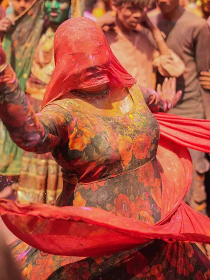 A vibrant collection of images from the Holi celebrations in Braj, specifically Nandgaon. This series captures the pure ecstasy of the festival, with portraits of devotees, men dressed as gopis, and crowds dancing in a cloud of colors.
