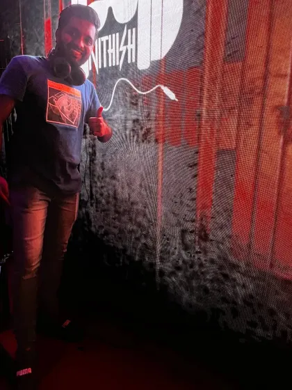 Posing next to the giant LED wall featuring my logo. It's always a great feeling to see my name up in lights at a big event.