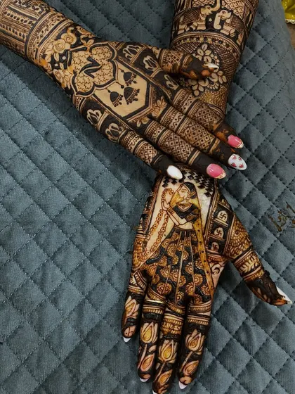 A detailed back-hand design featuring a bride portrait and personalized initials. The use of negative space makes the figures pop.