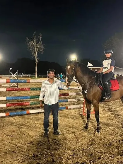 A moment between coach and rider after a successful 4 bar jumping event at the Verdinand Horse Show.