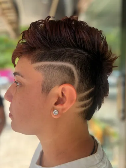 Another angle of the hair tattoo, showing a different pattern on the other side. This is all about personalized, creative expression.