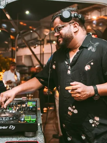 A candid moment behind the decks, enjoying the music as much as the crowd.
