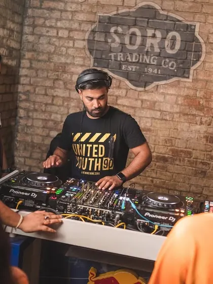 A candid moment of me working the Pioneer controller, ensuring every transition is smooth.