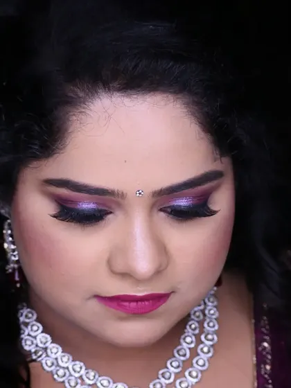 A detailed shot of the dramatic purple smokey eye, perfect for a bride who wants a bold and modern engagement look.