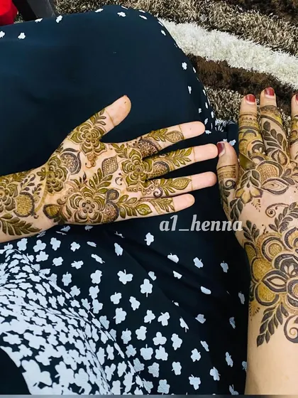 A floral design that leaves some open space on the palm for a lighter feel.