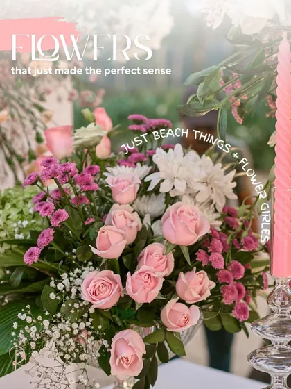 A beautiful arrangement of pink roses and other complementary flowers, perfectly suited for the beachside setting.