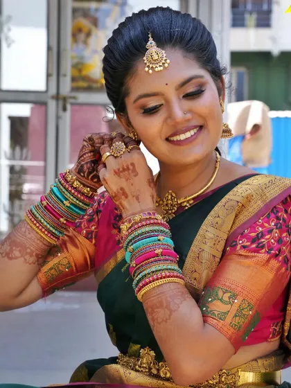 Meghana's smile is as radiant as her makeup. For her look, we kept the eyebrows natural as requested and focused on a glowing complexion with soft eye makeup to complement her temple jewellery.