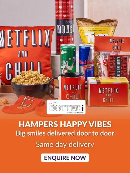 Here is my signature "Netflix and Chill" hamper, a bestseller for a reason. It's packed with gourmet popcorn, energy drinks, a comfy cushion, and other fun snacks, creating the ultimate binge-watching experience right out of the box.