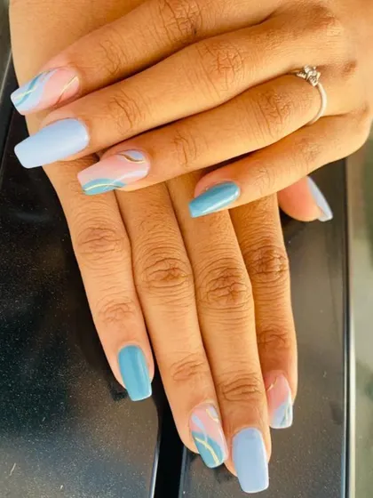 A soft and dreamy marble effect using pastel blue, pink, and hints of gold. This design is perfect for a subtle yet artistic touch on your nails.