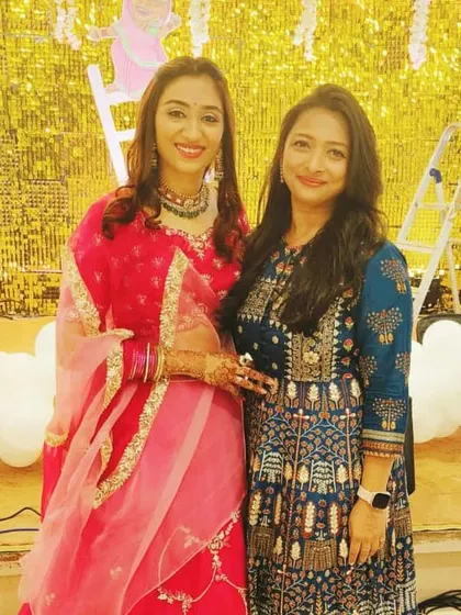 With the beautiful bride from the Sonigra family's Dhund ceremony. Her happiness is a testament to a well-executed event, from the glittering gold backdrop to the smooth flow of the ceremony I anchored.