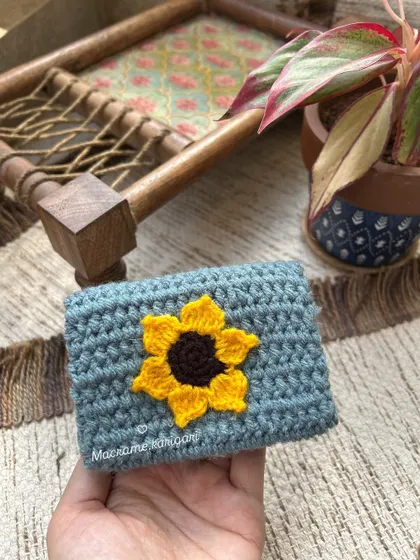 Another look at our popular sunflower mini wallet. The design is simple, cheerful, and a favorite among our customers.